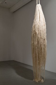 Homa Shojaie, Cocoon, 2011. Warps of Raw Canvas, 2′x2′x12′. © Homa Shojaie