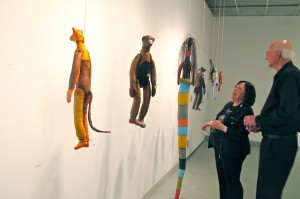 A wall of hand-stitched hanging creatures.