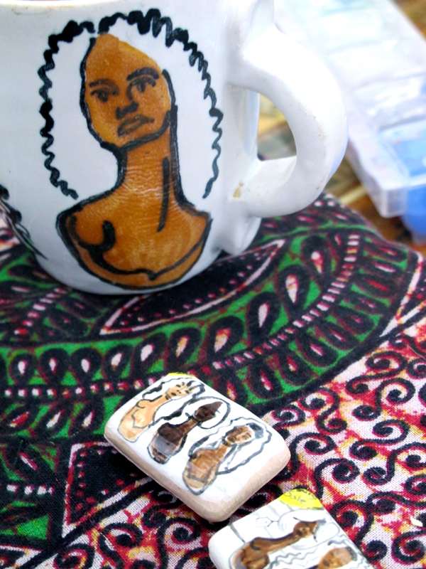 The "wig head" displays in downtown Hamtramck beauty supply stores are another of Wood&squot;s totems, rendered here in a ceramic mug and magnet.