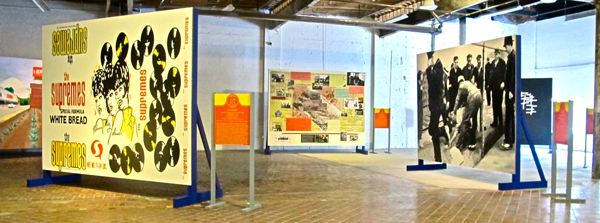 The works are installed on 9' x 12' billboard-style standing canvasses.