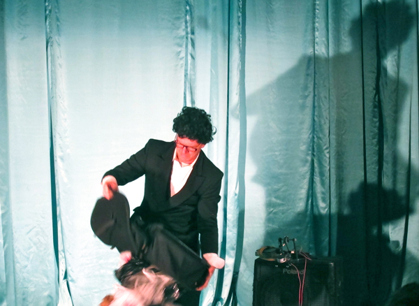 Jon Brumit performed a sound piece with "his orchestra"--audience members recruited at random to play instruments, including a symphony of plastic bags.