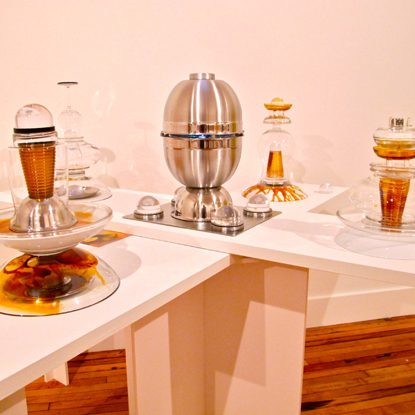 Another portion of work on display deals in carefully stacked glass and serviceware items.