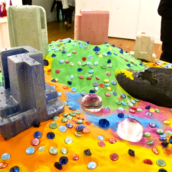 A styrofoam city under sand? A diamond in the rough? The world inside a snow globe?