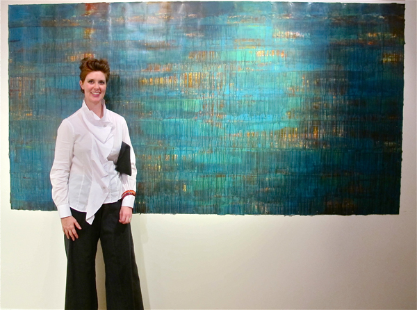 Langford at the opening night reception, with one of her most intense pieces.