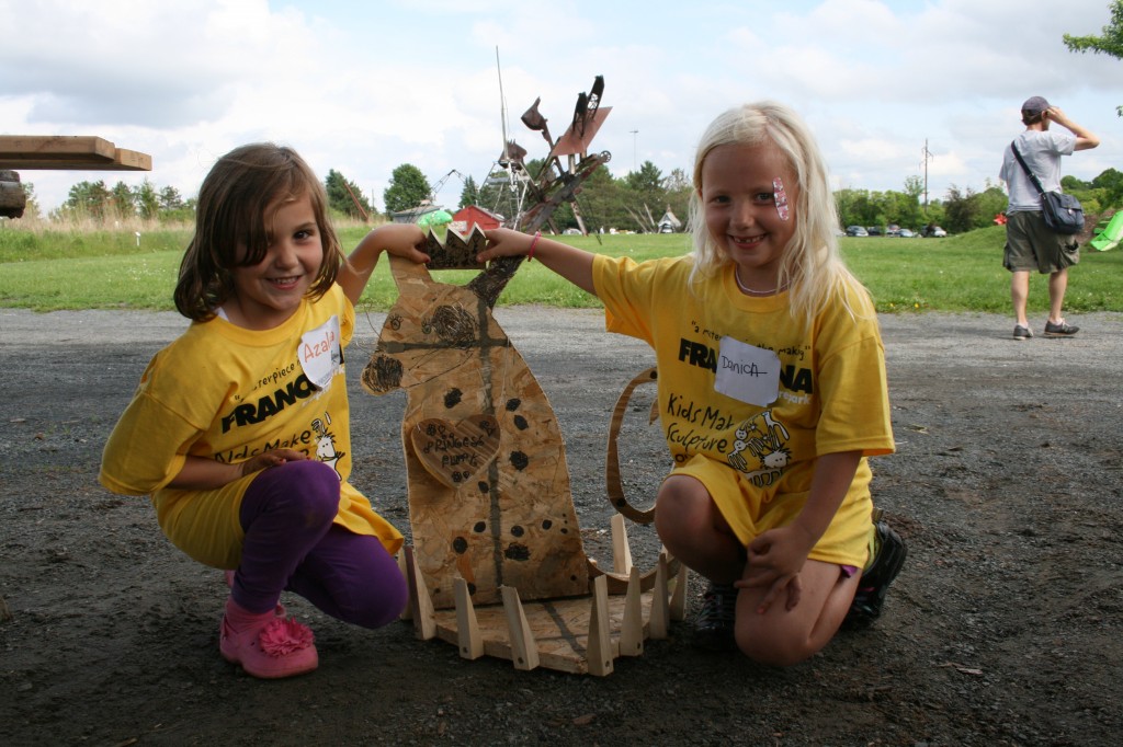 Artists with their work. Photo courtesy of Franconia Sculpture Park