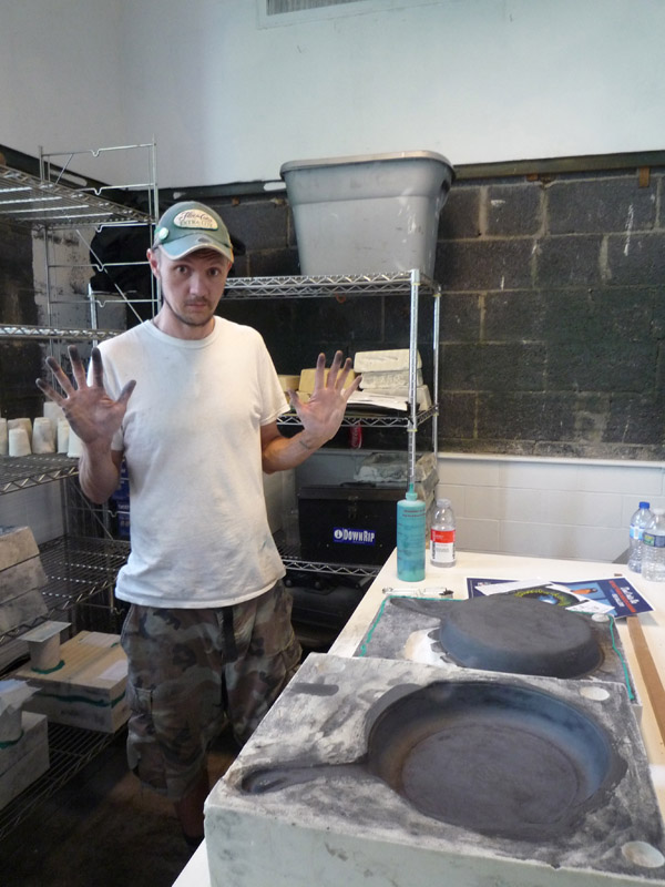 Garrett Maclean working on his salvage-based skillet set.