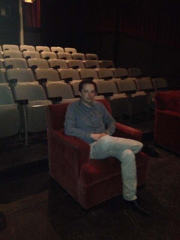 Steve Felix, executive director, Akron Film+PIxel, seated in The Nightlight Cinema.