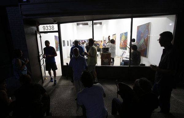 The opening night crowd outside 9338 Campau. Photo by Rebecca Cook, courtesy of the gallery.