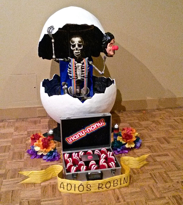 An behind-the-scenes peek at an ofrenda for Robin Williams, one of many beautiful works in the group show.