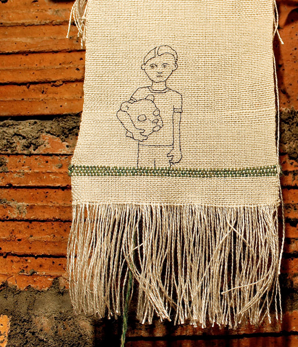"Bear Mask" weaving by Megan Diviney, curated by Liz Lewis.