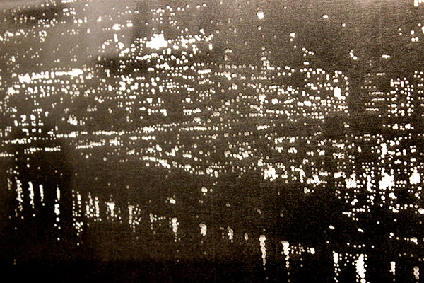 Detail from one of Campbell's nighttime landscapes, where every point of light is a hole in the paper.