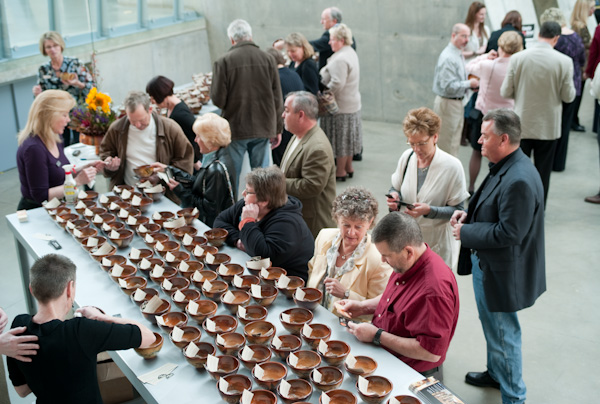 Guests selecting bowls at the Empty Bowl Project 2010. Photo courtesy of Zeber-Martell Studio