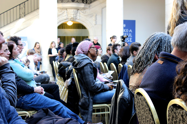 The crowd was solemn, but focused on the readers, with an intensity even beyond the norm for poetry readings.